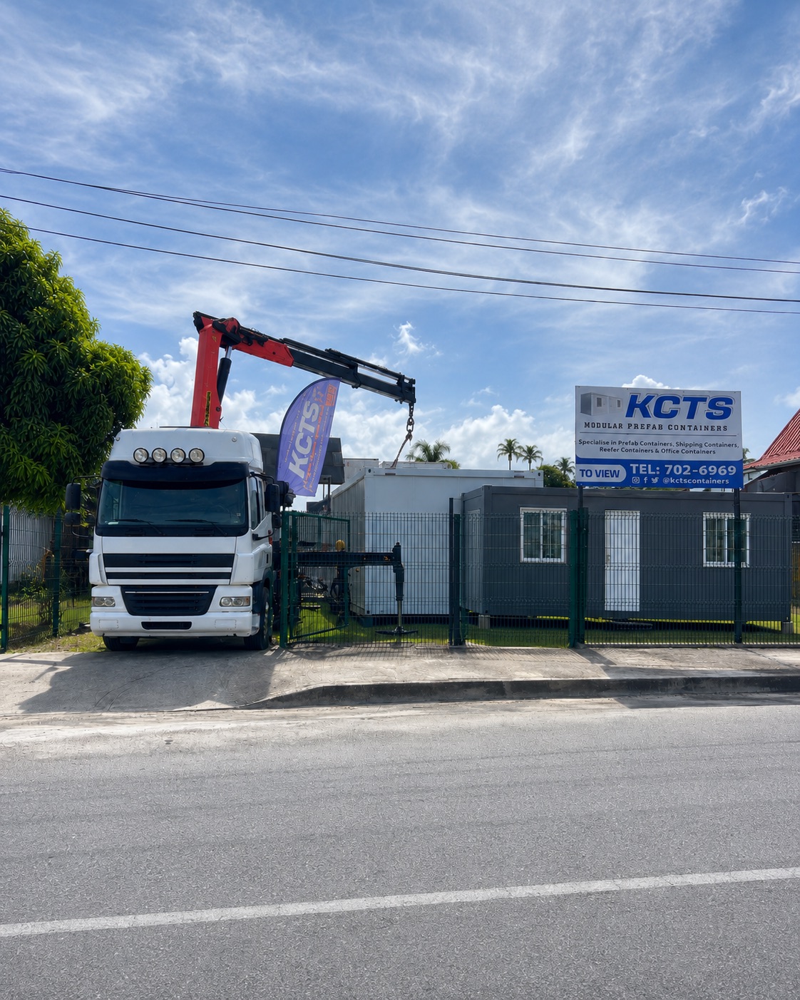 KENCE crane truck offloading a container at the Trinidad yard